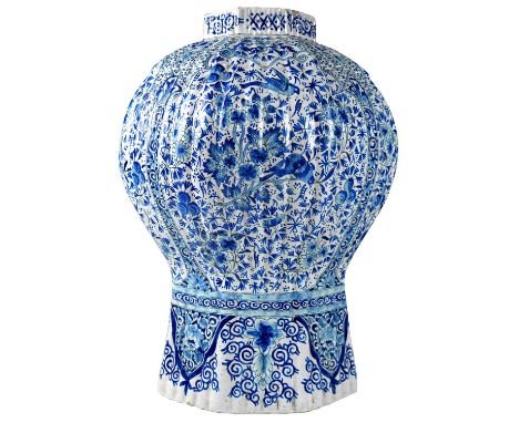 A Dutch Delft large blue and white vase Of octagonal section and balaster form, decorated in Chinese taste, with panels of fl