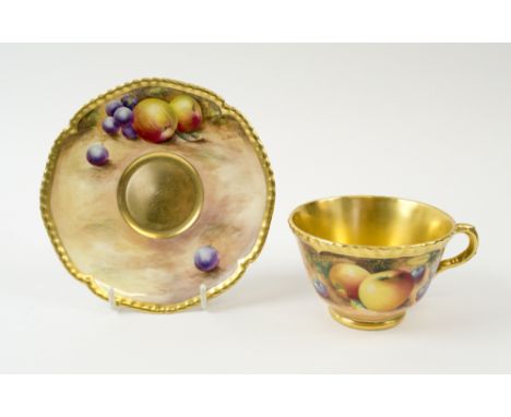 ROYAL WORCESTER CUP AND SAUCER, early 20th century both decorated fruit with gilt detailing. (2)