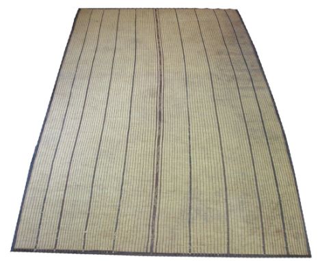 CONRAN TUARAG CARPET, 348cm x 226cm, woven reeds tribal design with leather trim, original price £1850. (with faults)