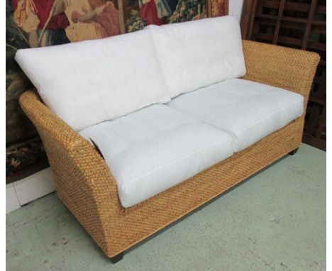 BELTON SOFA, two seater, in a plaited and woven water hyacinth finish with lacquered black feet, 184cm L x 85cm D x 77cm H. 