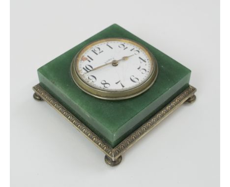 TABLE TOP CLOCK, the timepiece with damaged dial, set in a green jade block with silver supports, hallmarked London 1908, 7cm