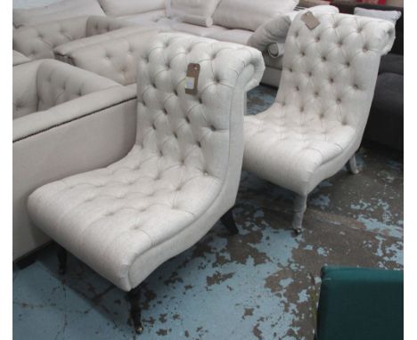 BUTTON BACK EASY CHAIRS, a pair, in oatmeal fabric on front castors, 68cm x 81cm x 104cm H. (2)