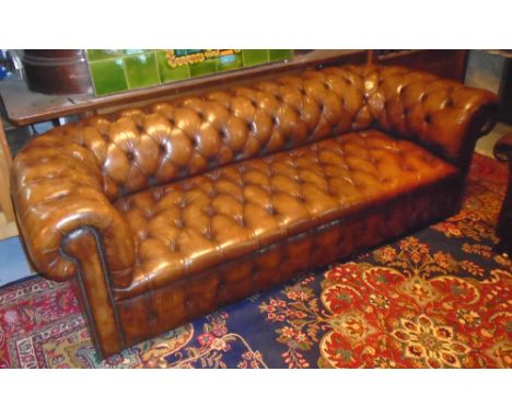 CHESTERFIELD SOFA, vintage antique tan brown hide with fully buttoned, rounded back, arms and seat, 220cm W. 