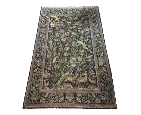 VINTAGE KASHAN CARPET, 220cm x 138cm, tree of life and exotic bird allover design on a midnight blue field within correspondi