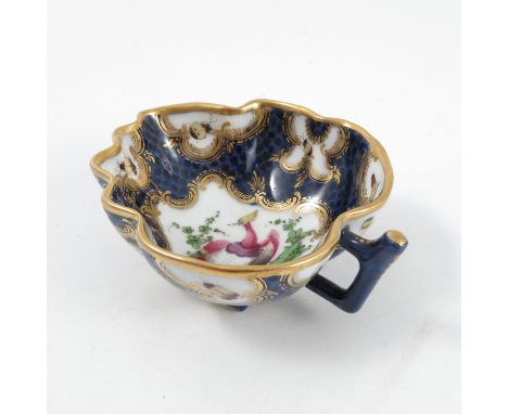 A Samson of Paris pickle dish, formed as a leaf, decorated with reserves of a fabulous bird and insects to a scale blue groun