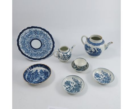 A collection of 18th century Royal Worcester blue and white teaware, comprising two tea pots, a Three Flowers tea bowl and sa