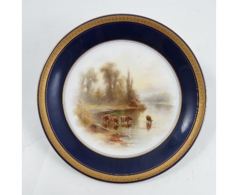 A Royal Worcester plate, decorated with English cattle watering by Stinton, with a blue and gilt border, diameter 9ins, circa