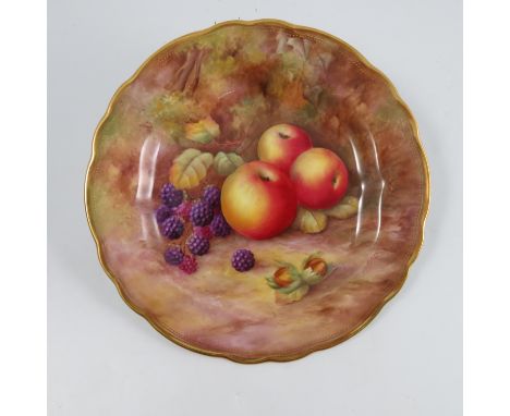 A Royal Worcester cabinet plate, decorated with fruit to a mossy background by H H Price, to a shaped gilt edge, diameter 9in