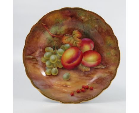 A Royal Worcester cabinet plate, decorated with fruit to a mossy background by H H Price, to a shaped gilt edge, diameter 9in