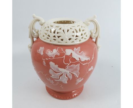 A Graingers Worcester pate-sur-pate vase, attributed to Kate Locke, decorated with flowers in white on a salmon coloured grou