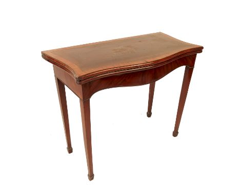 A Georgian style fold over mahogany card table, having cross banded top raised on square tapering legs, width 34ins