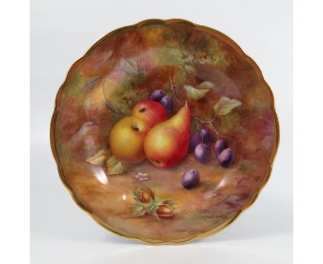 A Royal Worcester cabinet plate, decorated with fruit to a mossy background by H H Price, to a shaped gilt edge, diameter 9in