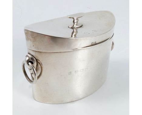 A silver oval tea caddy, the curved hinged lid with oval knop and engraved with initials, having ring handles, Birmingham 191