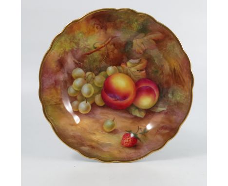 A Royal Worcester cabinet plate, decorated with fruit to a mossy background by H H Price, to a shaped gilt edge, diameter 9in