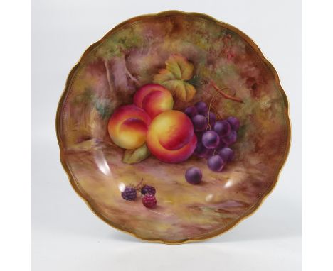 A Royal Worcester cabinet plate, decorated with fruit to a mossy background by H H Price, to a shaped gilt edge, diameter 9in