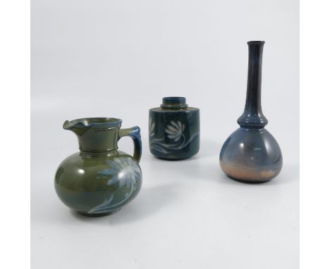 Three pieces of Royal Worcester Sabrina Ware, in the Art Nouveau style, comprising a tea caddy, bottle vase and small jug wit