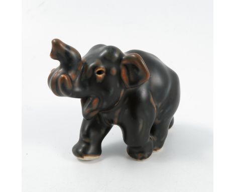 A Royal Copenhagen model, of an elephant calf, in a brown glaze, by Knud Kyhn, factory mark and KK, height 3insCondition Repo