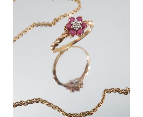 A ruby and diamond cluster ring, stamped '585', finger size P 1/2, 1.5g gross, cased, together with a ruby and diamond neckla