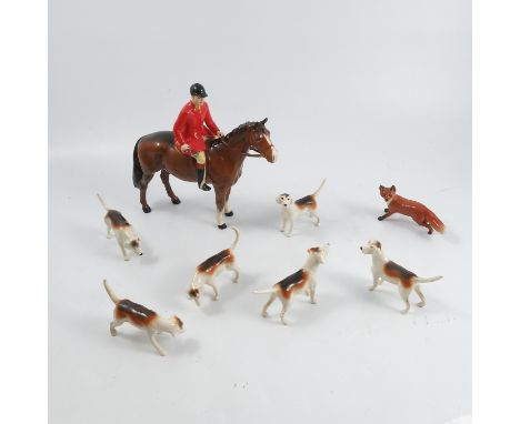 A Beswick model of a huntsman in pinks, astride a bay horse, with six hounds and a foxCondition Report:  Inspected and no iss