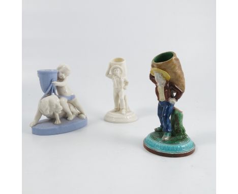 Three Royal Worcester figures, comprising two of Le Charbonniere or The Coalman, one in Majolica ware with coloured glazes, t