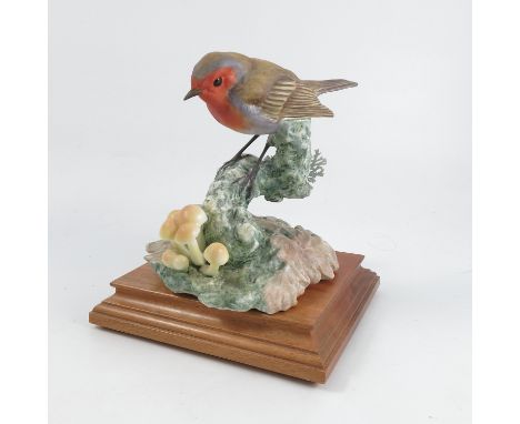 A Royal Worcester limited edition figure, of a robin in autumnal woods, modelled by Dorothy Doughty from the British Birds se