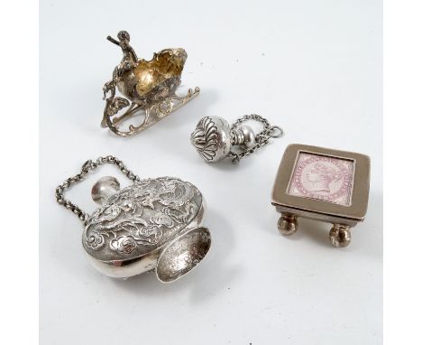 A collection of novelty silver items, to include a stamp box, with stamp to the lid, curved body raised on ball feet, stamped