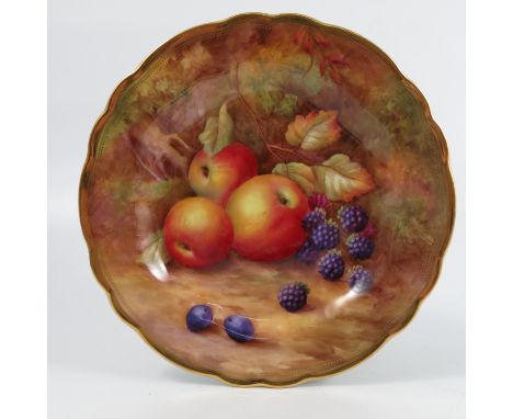 A Royal Worcester cabinet plate, decorated with fruit to a mossy background by H H Price, to a shaped gilt edge, diameter 9in