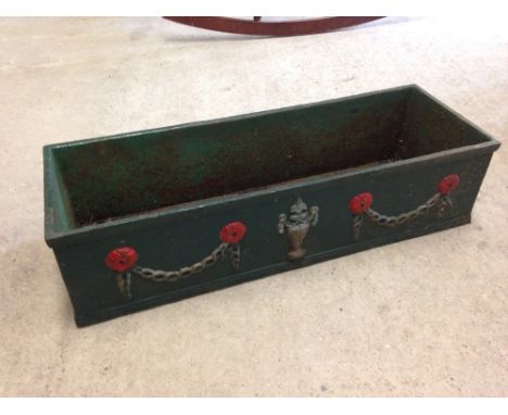 A cast iron painted windowbox / planter, 60cm wide.