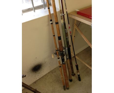 4 vintage fishing rods to include a bamboo cane sea rod with Penn Senator 113 reel
