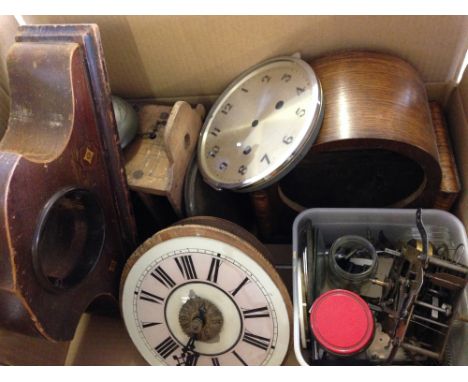 A box of old clock parts.