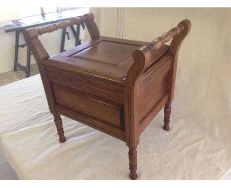 A Victorian commode with turned handles and legs.