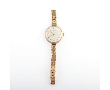 A ladies Rotary wrist watch, the dial having hourly Arabic numeral markers with minute track border, on a hallmarked 9ct yell