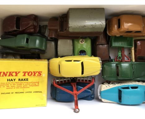 A box of model cars, trucks and harvesting tools, including boxed Dinky toys 324 Hay Rake, eighteen items in total.