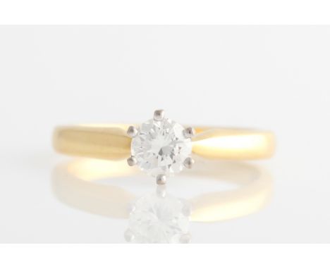 A hallmarked 18ct yellow gold diamond solitaire ring set with a round brilliant cut diamond measuring approx. 0.50ct, ring si