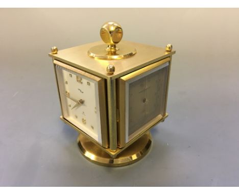 An ImHof combo Barometer, thermometer, hygrometer, clock on rotating base.