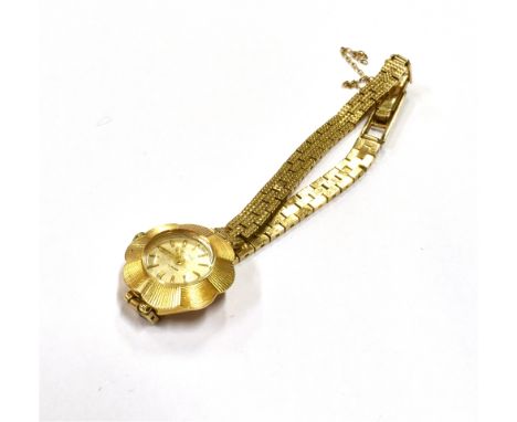 9CT GOLD LADIES VINTAGE DRESS WATCH Circa 1960, 19.0mm fluted shaped case, stamped .375, silvered dial, gold hands and batons