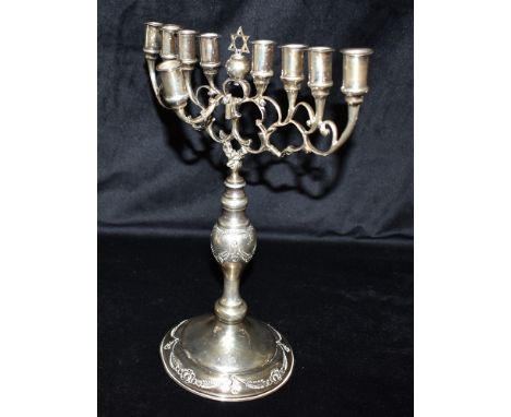 GEORGE V STERLING SILVER MENORAH Stands 32cm high, with 9 branches above baluster shaped pedestal and circular base, decorate