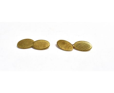 9CT GOLD CUFFLINKS Oval in shape with engine turned decoration and cable chain links, hallmarked 9.375 London 1965.  Weight 7