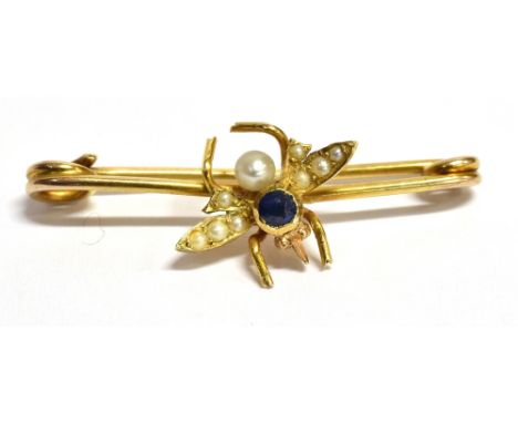 15CT GOLD GEM SET BEE BROOCH 3cm long, tests as 15ct gold, depicting a bee with half seed pearl grain set wings, a cornflower