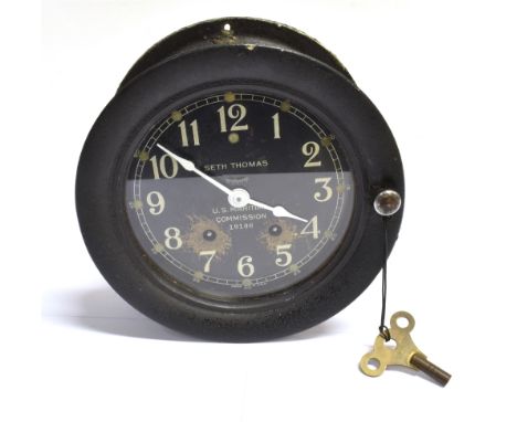 A SETH THOMAS SHIP'S BULKHEAD CLOCK  the 14cm (5 1/2 inch) diameter black dial with white Arabic numerals and marked 'SETH TH