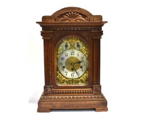 AN EDWARDIAN MANTEL CLOCK  The steel and gilt face fitted with a three-train movement, and chime/silent and speed adjustment 