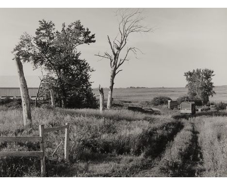 Gregory Conniff (American, b. 1944). Silver gelatin photograph titled "Near Northfield, MN (Farmyard)" depicting a country fi