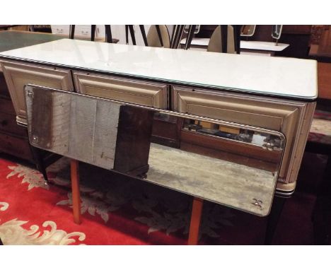 An Italian Umberto Mascagni 1950's/60's mirror backed cushion fronted designer three door sideboard raised on tapering suppor