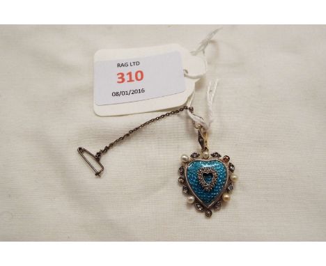 A heart shaped pendant inset with blue enamel, seed pearls and diamonds  1" x 3/4" three seed pearls missing, white enamel bo