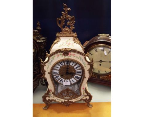 A late 20thC German FHS mantel clock, the scrolling foliate brass mounted case decorated with hand-painted floral sprays with