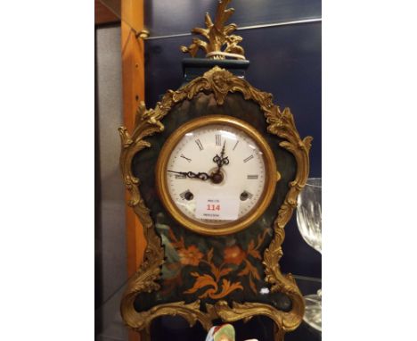 A late 20thC floral inlaid German mantle clock with enamel dial and Roman numerals decorated with scrolling brass floral bord