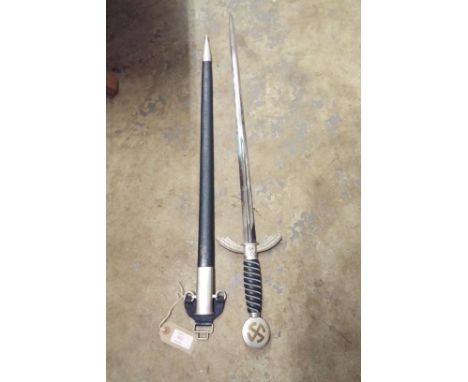 A German Nazi Luftwaffe dress sword the blade engraved Solingen, with blue leather scabbard and grip  Marked SMF Solingen to 