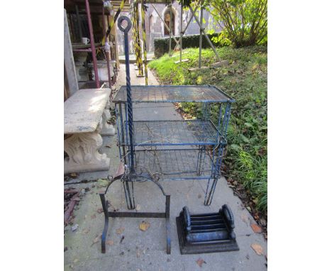 A cast iron boot scraper of rectangular form with scrolled acanthus detail, together with a further iron work boot scraper fr