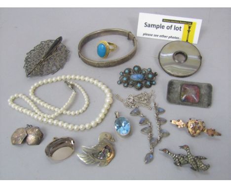 A large collection of costume jewellery to include a 9ct sweetheart brooch, turquoise dress ring stamped '14', sterling silve