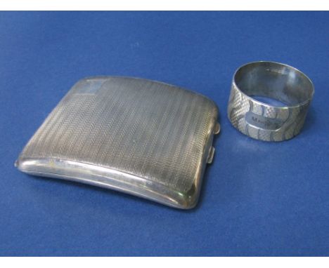 A silver engine turned card case with a further silver engine turned napkin ring inscribed Marilyn, 3oz approx